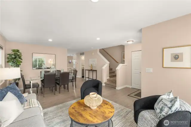 Formal living and dining area with engineered hardwood and neutral interior paint.