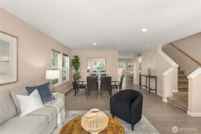 Formal living and dining area with engineered hardwood and neutral interior paint.