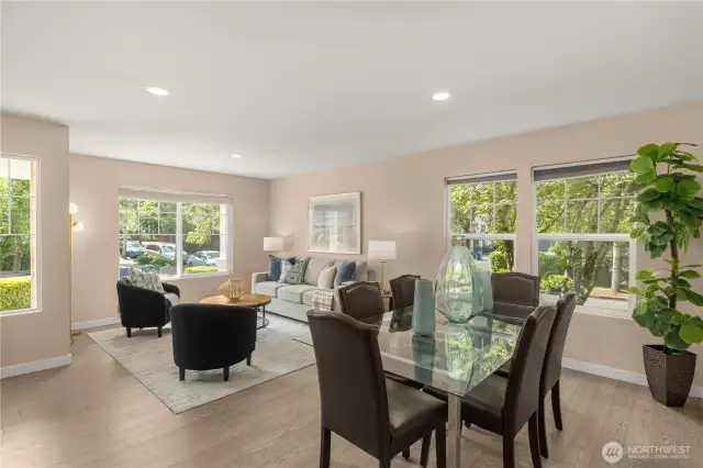 Formal living and dining with engineered hardwood floor and neutral interior paint
