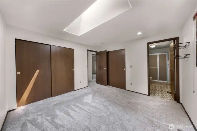 primary bedroom with ensuite- this room also has a skylight to provide lots of natural light.
