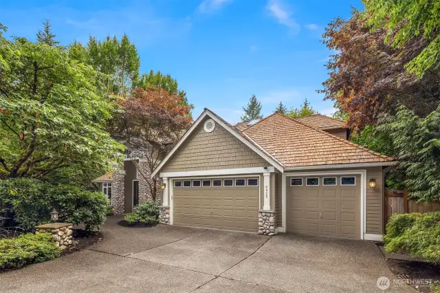 Down the long driveway you'll find this beautiful home with 3 car garage and plenty of room for driveway parking, as well as a basketball hoop!  Amazingly private, surrounded by mature landscaping.