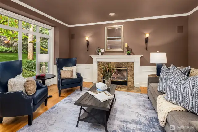 The views from this room are simply stunning, looking out over the front yard.  Mature plantings block out all signs of the street, offering you complete privacy in this home.