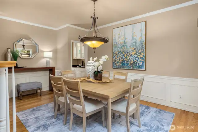 From dining room head through the butler's pantry into the kitchen.  The butler's pantry boasts plentiful storage, a counter, great for buffets, and glass upper cabinets to show off your favorite collections.