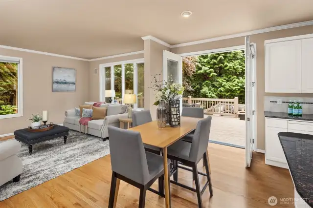French doors open to the two-tiered deck, which extends across the entire length of the house.  This home begs to entertain!