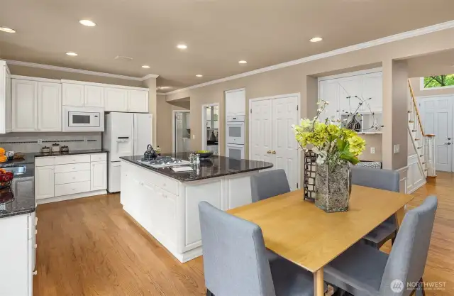 A great view to show where the front door is, and to show that a large table can easily sit between the kitchen and the family room.