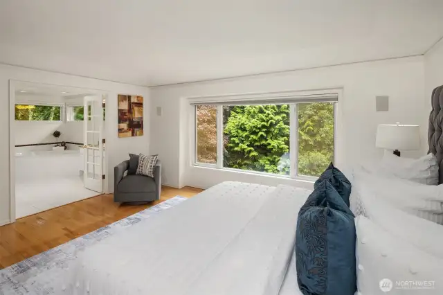 Crisp white walls and a graceful tray ceiling create an airy, serene retreat.  Bedroom opens to full bathroom, with soaking tub and walk-in closet, as well as separate WC.
