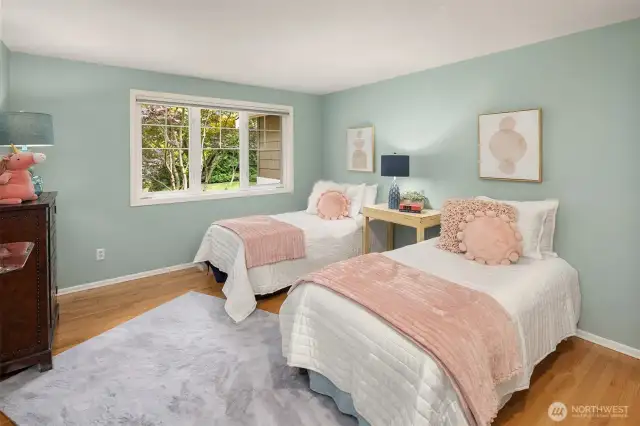 Bedroom #4 a serene retreat, looks over the front yard.