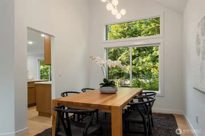 Dining room overlooks the lush backyard.