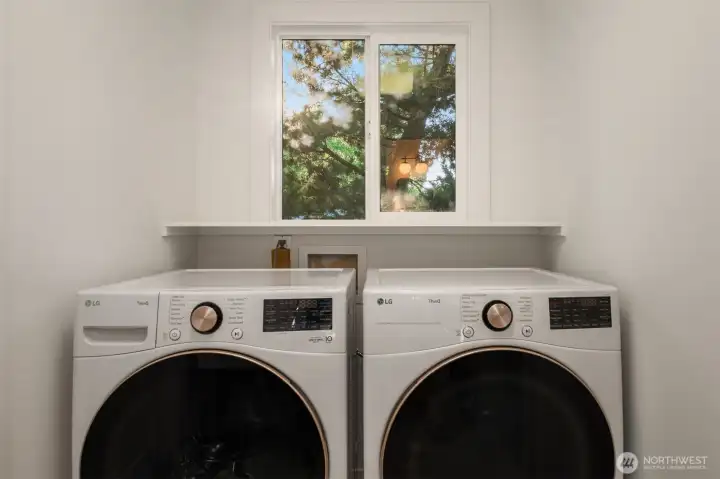 Laundry room off of garage for easy access.