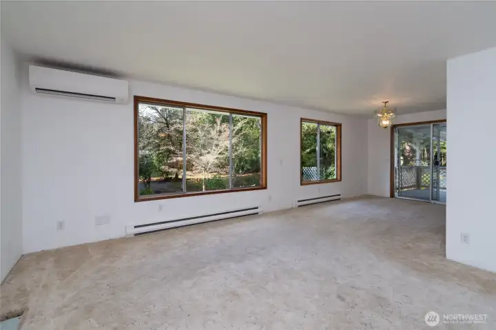 Living room and dining (upstairs). Ductless mini-split provides efficient heating and cooling.