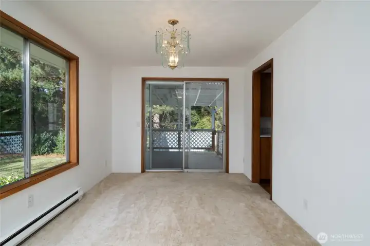 Dining room off kitchen and living room. Covered deck out slider.