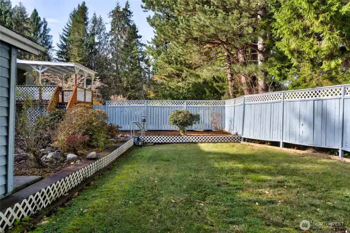 Side yard is fenced for privacy.