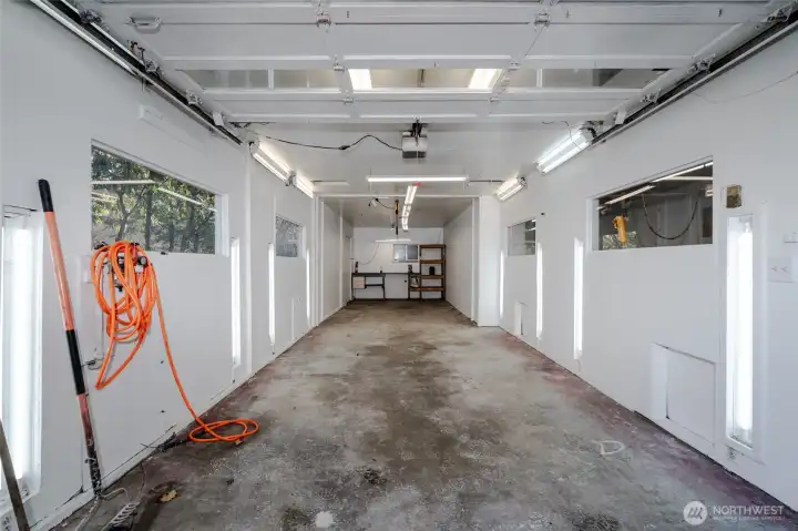 Inside one of the shop bays, ample lighting and plumbed for compressed air. This area was previously used to paint project cars.