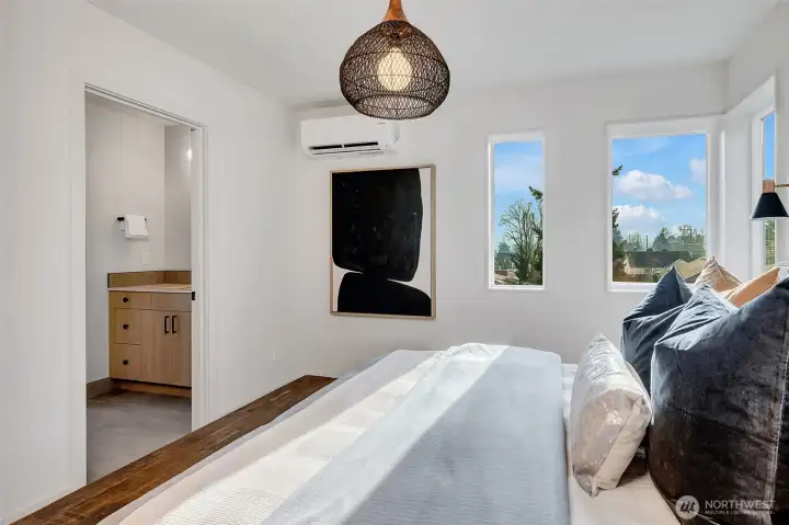 Corner vertical windows to maximize the light and an efficient mini-split with air conditioning for year-round comfort.