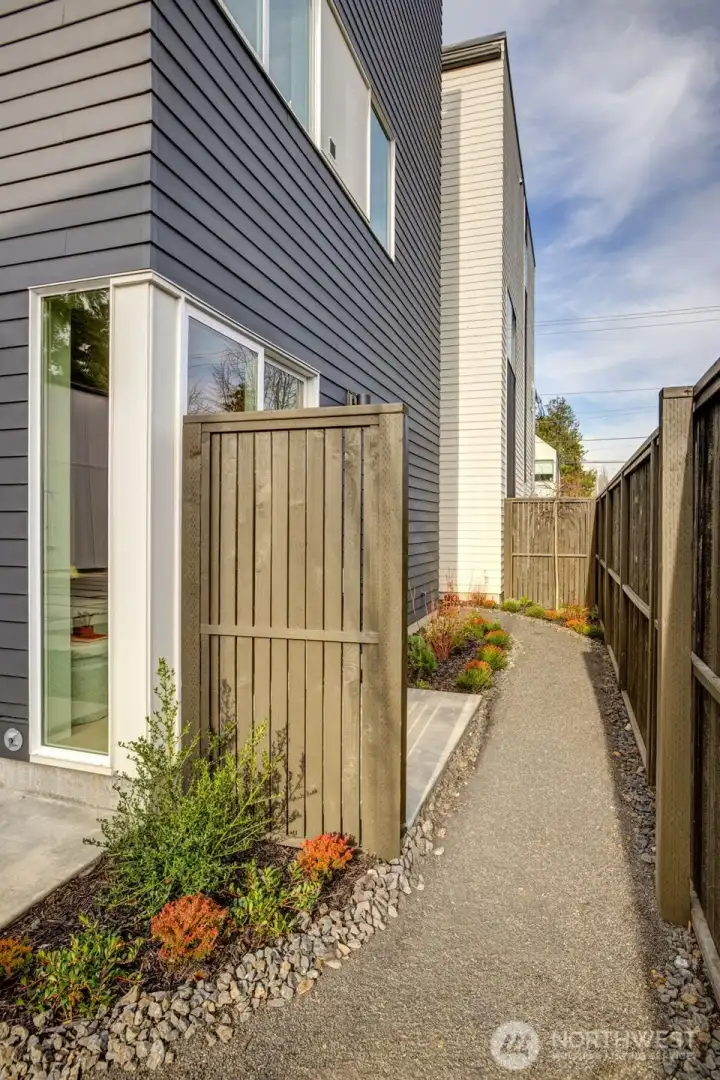 Vertical corner windows summon light. All the homes have air conditioning and efficient, high-end systems.