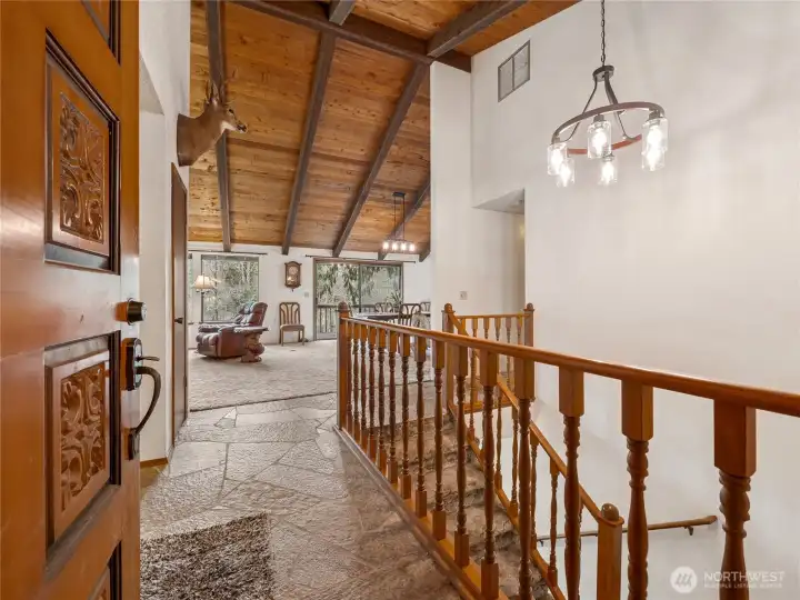 As you enter the home, note the gorgeous vaulted wooden-beamed ceiling and updated light fixtures.