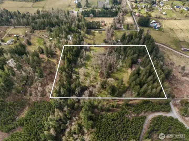 This view faces to the west. You can see the house in the upper right part of the lot lines.