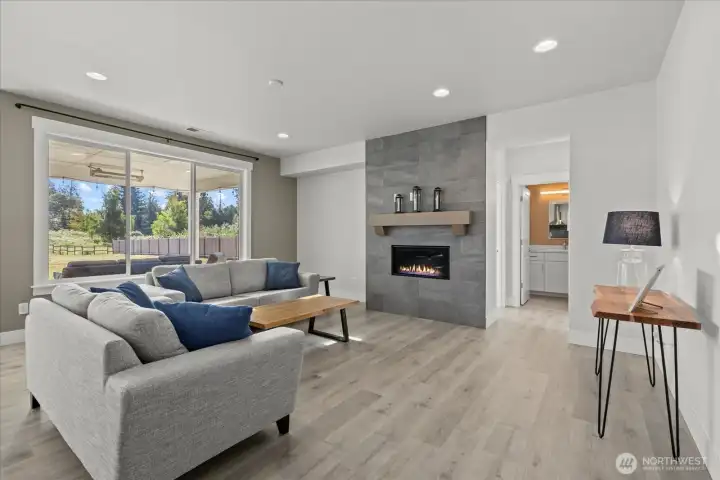 Main living area featuring fireplace and LVP.
