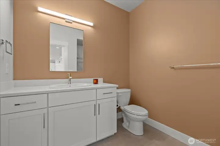 Main floor bathroom also features walk in shower.