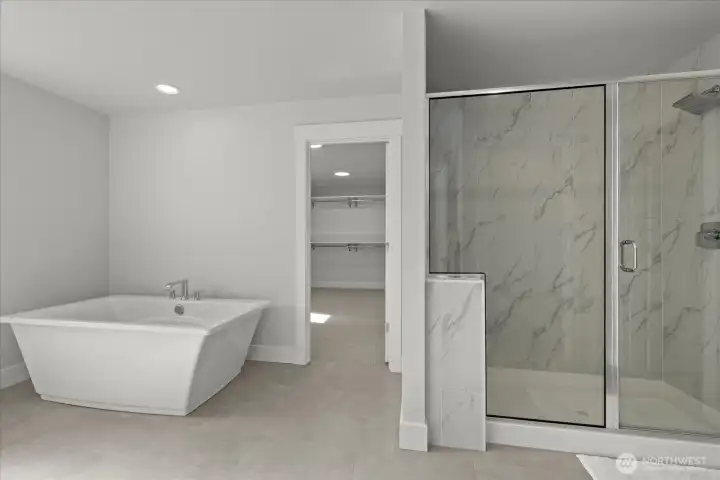 Primary bath with soaking tub and walk in shower.
