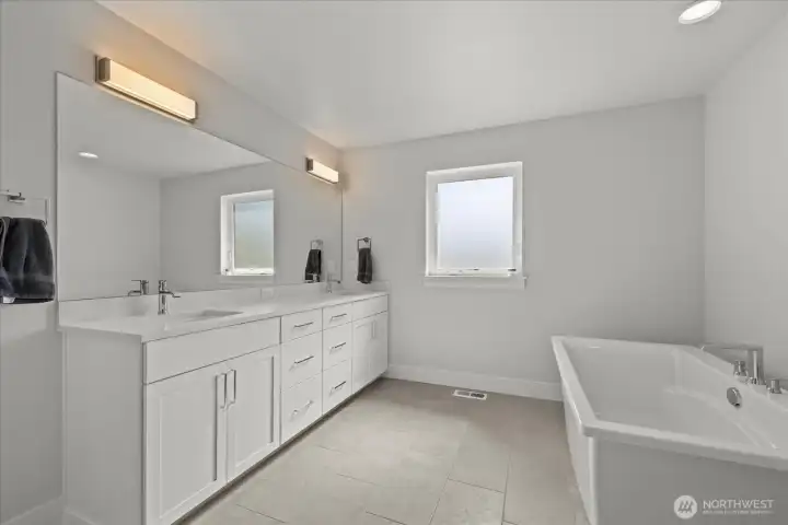 Dual sinks and soaker tub.
