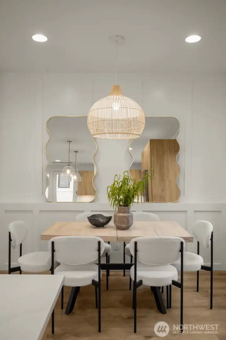 Open dining space with luxe pendant light
