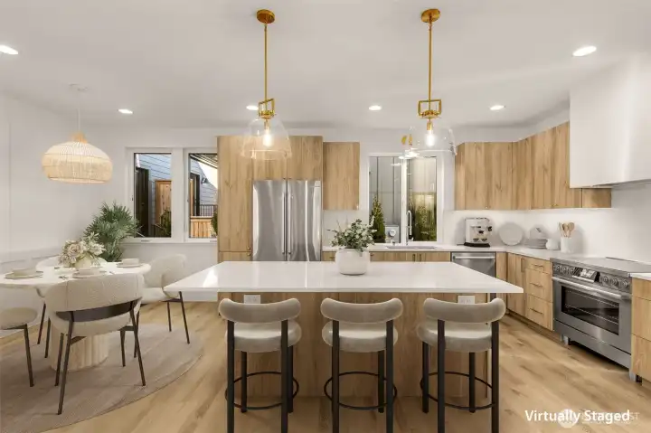 Bellmont cabinetry, Calacatta quartz, and Bosch appliances with a 36” induction range.