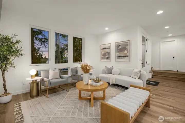 Spacious living area with designer lighting.