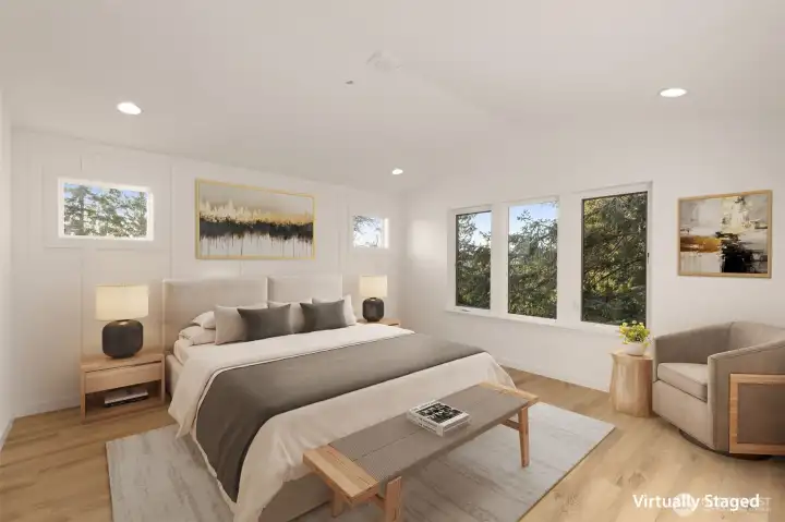 A calm, comfortable primary suite retreat with designer finishes and oversized windows.