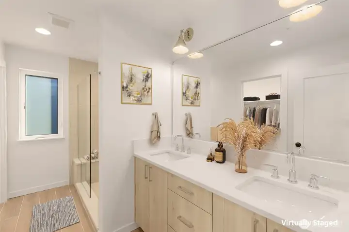 Spa-inspired primary bath with heated floors and thoughtfully selected tile.