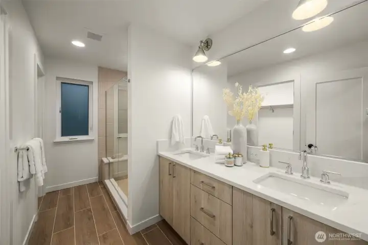 Spa-inspired primary bath with heated floors and thoughtfully selected tile.