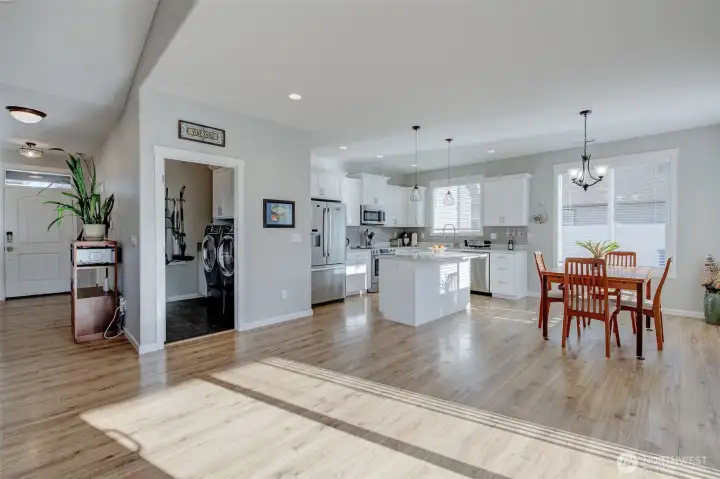 Multi-functional room next to the kitchen houses the laundry area, pantry storage and utility sink!
