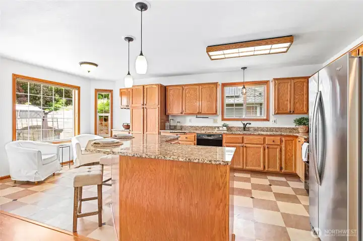 Large kitchen with functional layout and granite countertops