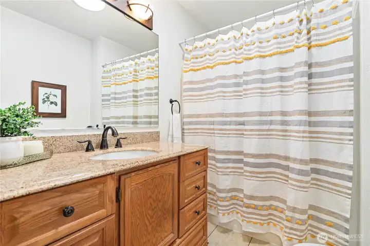 Full, hall bathroom with extra storage space