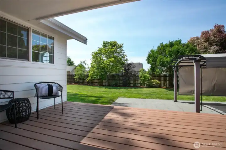Large back deck, entering to a fully fenced backyard