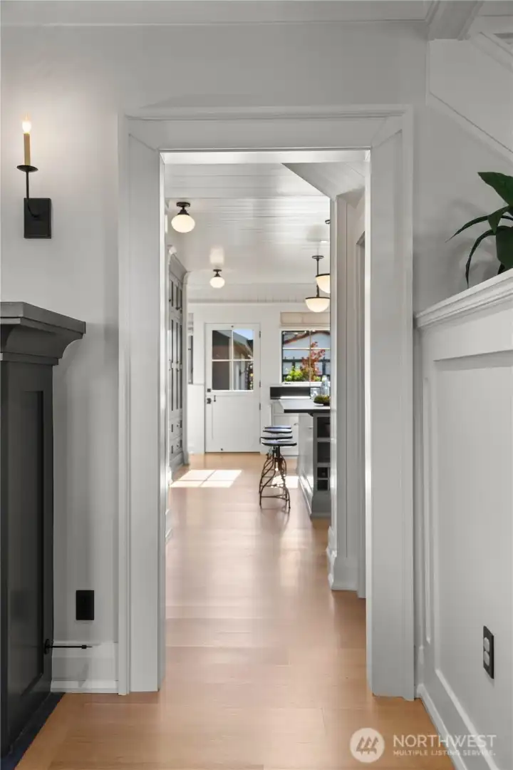 Blending elevated farmhouse warmth with classic Craftsman architecture, the home offers beautifully scaled living spaces filled with natural light, custom millwork, designer Visual Comfort lighting, built-in casework and cabinetry, and refined yet livable elegance with generous storage. Premium details abound, including solid brass and bronze hardware, Armac Martin cabinet hardware, and Rohl plumbing fixtures throughout.