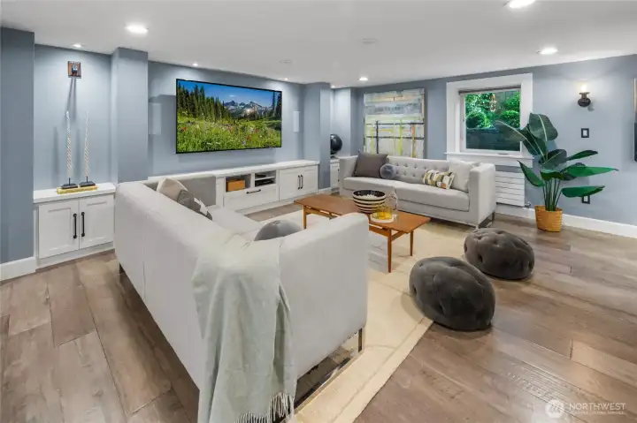The lower level offers exceptional flexibility with a spacious rec room, third bedroom, ¾ bath, and laundry area—ideal for guests, media space, or work-from-home living.