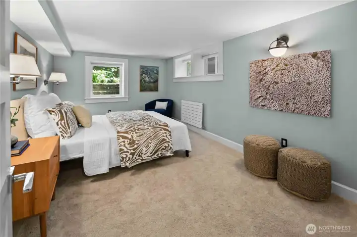 Third bedroom, ¾ bath, and laundry area—ideal for guests!