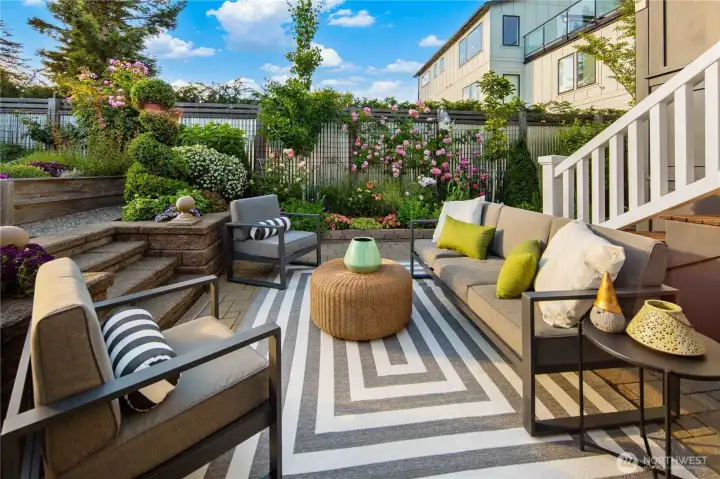 Impeccably maintained gardens and lush landscaping with an extensive drip system create a private retreat.