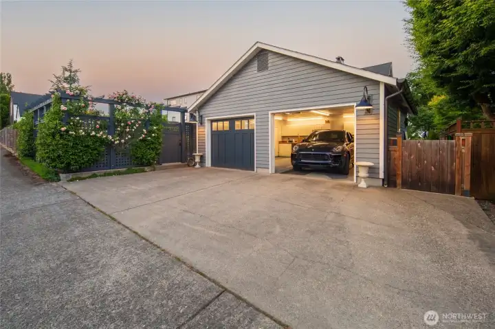 Oversized two-car garage with alley access and additional parking adds convenience and functionality.