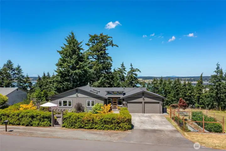 Come and see! A serene and picturesque location, with filtered water views of Penn Cove on a sunny lot near to historic downtown Coupeville.