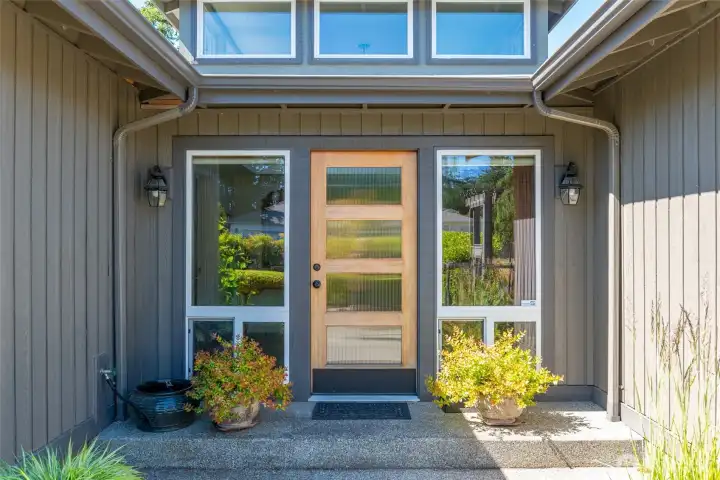 Inviting entrance. Solid wood door privacy glass.