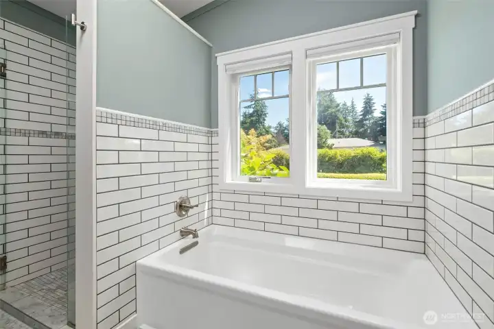 fully tiled bath surround and shower, frameless shower door