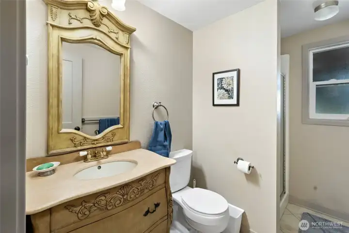 lower level 3/4 bathroom with tiled floors
