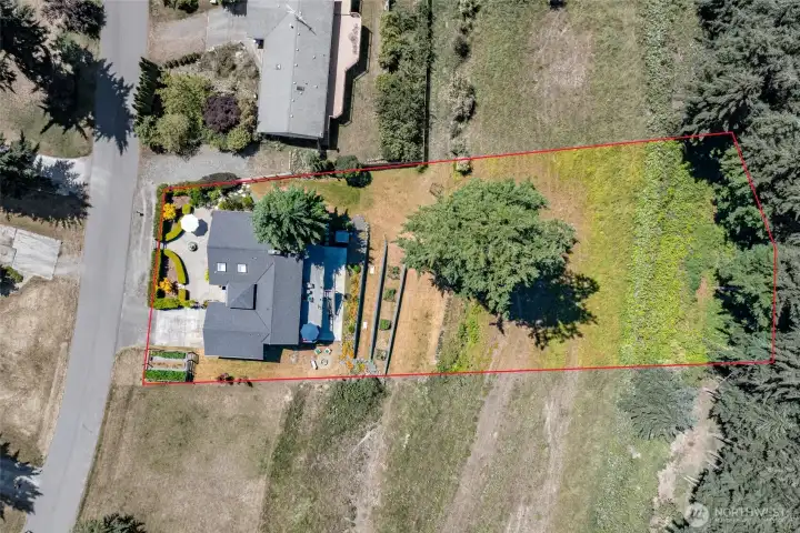 property is just shy of an acre, plenty of space and endless possibilities. Property lines are approximate. Buyers to verify.