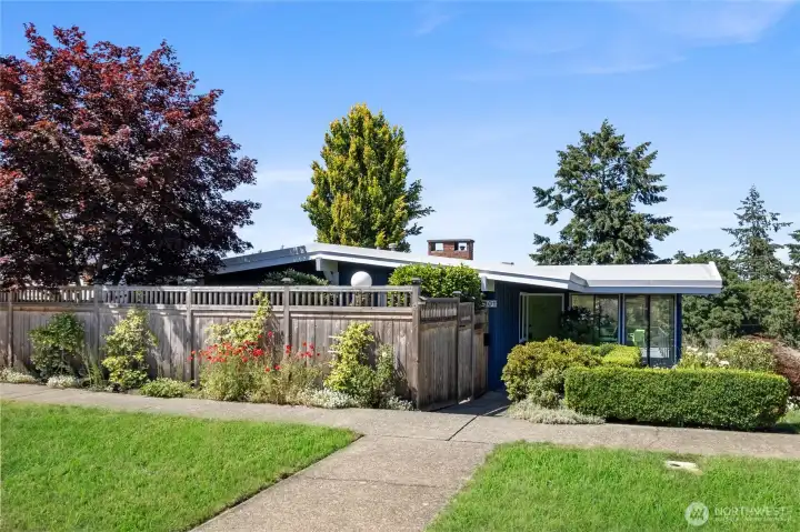 Front facade with private garden area to the left