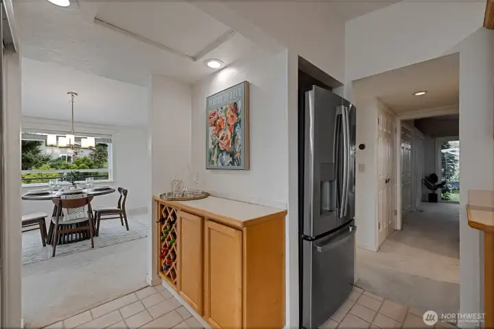 Pantry to left and serving bar with wine rack to the right.