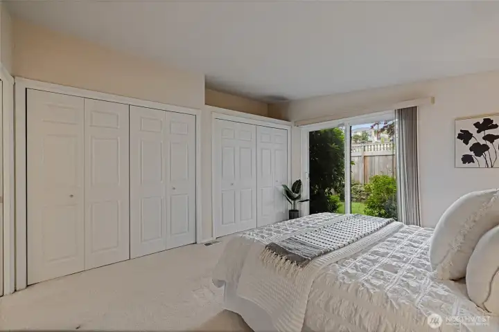 Primary bedroom opens to private garden and has a large closet.