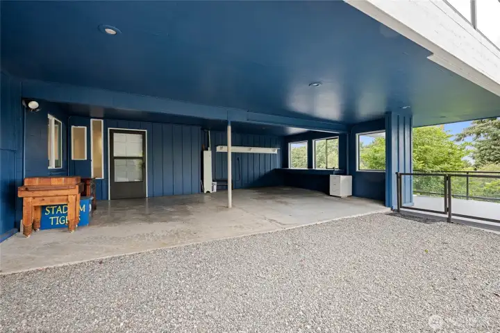 Carport on lower level with storage area