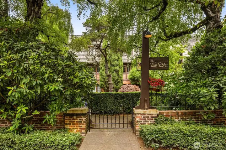 The Twin Gables is a rare and beloved Frederick Anhalt Condominium. From the tree-lined street, the castle-like silhouette, iron gate, and rich masonry radiate so much appeal.